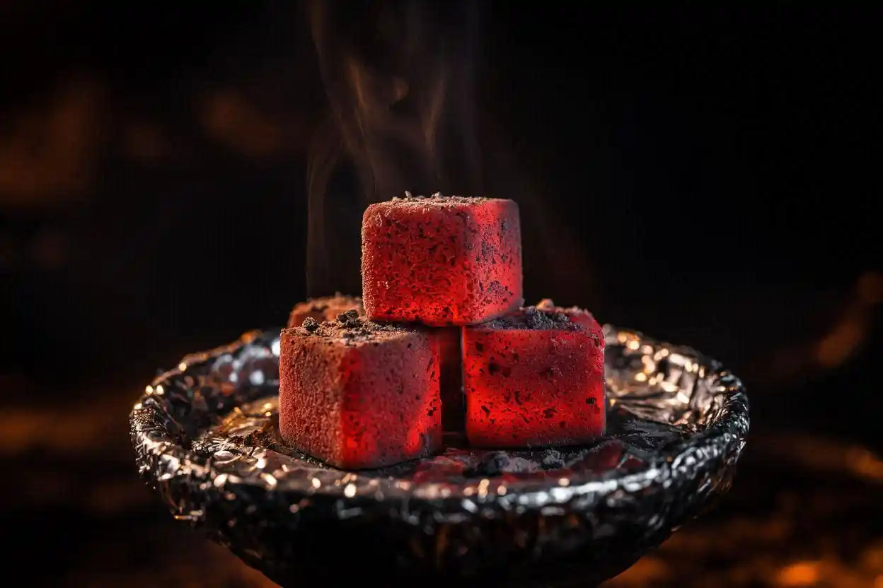 Glowing coconut shell charcoal cubes on hookah bowl showing ideal shisha charcoal burning temperature